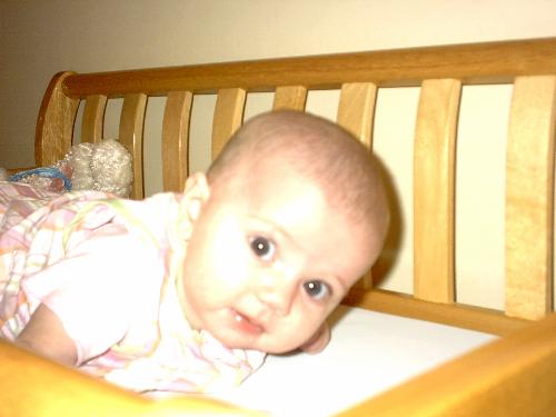Chilling Out - This is Julia in her crib, looking very relaxed. her eyes are so expressive and beautiful. the photo was taken April 27th, 2003. she was 14 months old at the time.