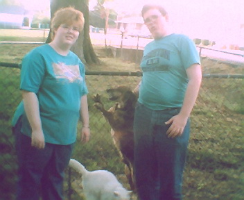 Jake and Kids - This is a picture I took this afternoon of Amanda, Stuart and Jake. Jake loves for you to come to the fence and give him a pet. A lot of times he will sit there waiting for you to come see him and he looks as though he is grinning! Wilbur decided he would come along and get into the picture as an after thought!!
Ha! Ha! Jake and Kids - This is a picture I took this afternoon of Amanda, Stuart and Jake. Jake loves for you to come to the fence and give him a pet. A lot of times he will sit there waiting for you to come see him and he looks as though he is grinning! Wilbur decided he would come along and get into the picture as an after thought!!
Ha! Ha!