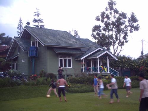 puncak megamendung - view of side yard village,playing soccer for fun