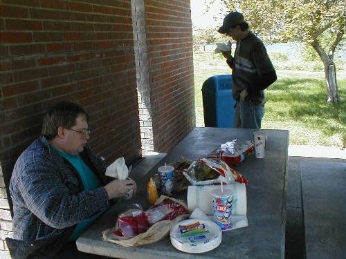 Me and my friend Logan eating lunch in a rest area - In 2002 my friend Ray, Logan and Logan's ex wife traveled to the Black Hills of South Dakota via Interstate 80 in Nebraska. This is a picture of Logan and I eating lunch at a rest area along I-80.