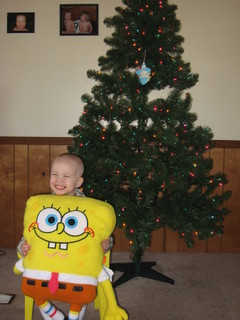 Spongebob Squarepants - My son at Christmas 2006 with his new Spongebob pajamas, huge Spongebob stuffed toy, sitting in his Spongebob chair in front of our Christmas tree.