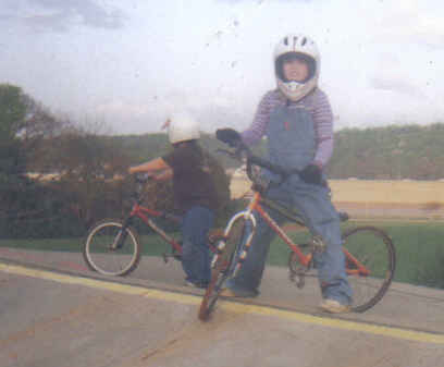 bmx - This is Tara on the top of the hill at the BMX track. She loved to fly around the track. She had a wreck the first week but went right back after picking the asphalt out of it!