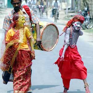 boys performing a road show  - Boys dressed as Lord Shiva and Goddess Parvati, performing a road show in Agartala, India.