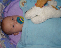 Devyn in his bassinet - Here he was only about 2 months old. lol He has a pacifier there. Man.. he gave that thing up a long time ago. lol