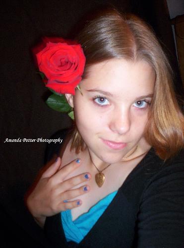 Girl with Rose - This photo is from the portfolio of Amanda Potter's Photography. I have permission to share a small selection of her work. I am very proud of my daughter. She has a talent for capturing beautiful photos.
