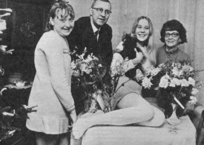 Agnetha Faltskog - one of the members of the abba singing group along with other people I don't know. Perhaps they're the producers or something...
