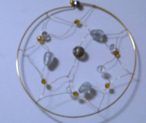 Suncatcher  - This photo is a suncatcher made from wire and beads. I make these myself