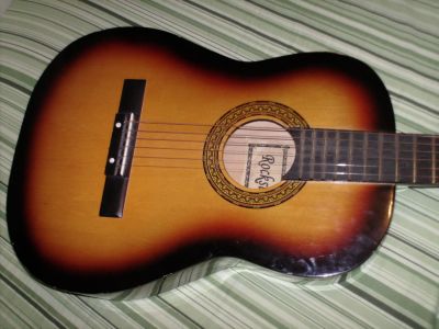 My Guitar - My acoustic guitar. Well, obviously, it has a flame-like color. It also has a nice sound. He's my company whenever I compose songs. By the way, his name is Rockstar.
