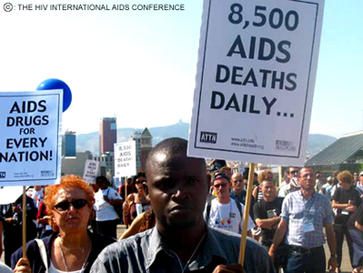AIDS treatment activists in Spain - This picture of AIDS treatment activists protesting outside the International AIDS conference in 2002. The 14th World Conference was held in Bracelona, Spain.