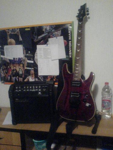 My guitar - This is my brand new guitar, Schecter Omen FR Extreme and an Ibanez amp I got with it. I'm really satisfied with my playing, because I made a huge progress by transferring from acoustic to electric guitar, and for everyone who hasn't tried it yet, I would recommend it. I play everything - from jazz, punk to metal, and this baby covers it all with no sweat. :)