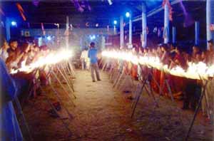 devotees lit earthen lamps - More than 5000 devotees lit a total of one lakh earthen lamps and prayed for world peace in Asom, India.