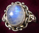 Rainbow moonstone ring. - This is a picture of a silver ring with a rainbow moonstone in it.