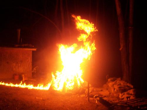 Fire! - This is a fire I built with my brother. Gasoline was used to start it up, but with the utmost safety. As you can see we used a trail leading to the fire to light it from a safe distance.