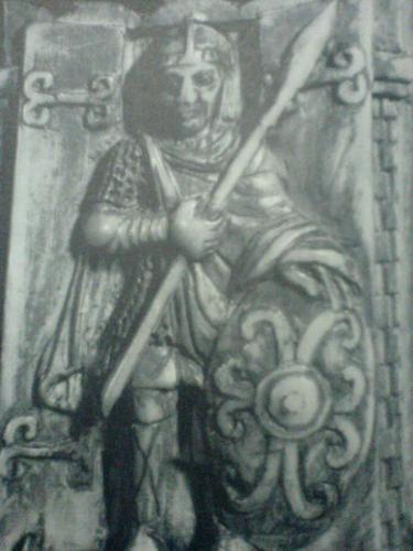 Guardian - A grim faced guardian stands before the gates of a fortified town in this ivory bas-relief carved around the year 1000. Already towns were developing, and this urbanization was among the factors social, political and economic that vitalized Western Europe toward the close of the early middle ages.
