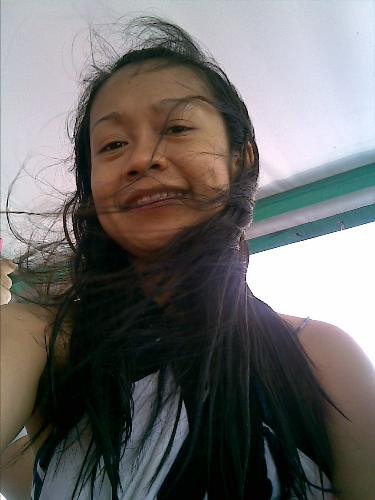 with hair flying away - caught myself with flying hair during one snorkelling moment in puerto galera :P