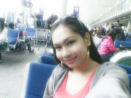 me2 - taken at HKIA before boarding for a flight back to manila...