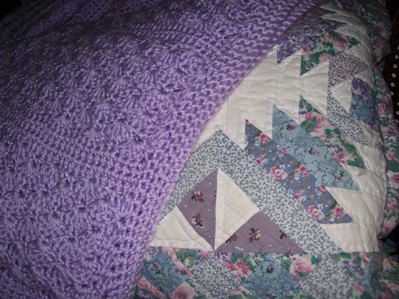 My Favorite Bedding - Handmade lilac crocheted afghan and multi-colored country patchwork quilt.