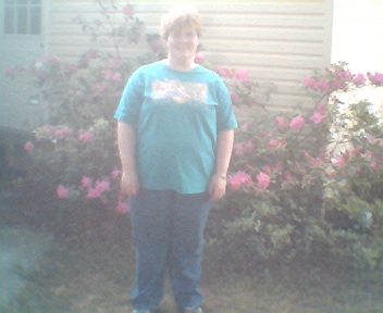 My daughter Amanda - She is standing outside with my azaleas before the winter blast hit over the weekend.