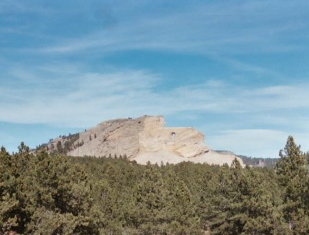 Crazy Horse Memorial - The Memorial's mission is to honor the culture, tradition and living heritage of North American Indians. When completed the Crazy Horse mountain carving will be 641 feet long by 563 feet high. Crazy Horse's completed head is 87 feet 6 inches high. The horse's head, currently the focus of work on the mountain, is 219 feet or 22 stories high.