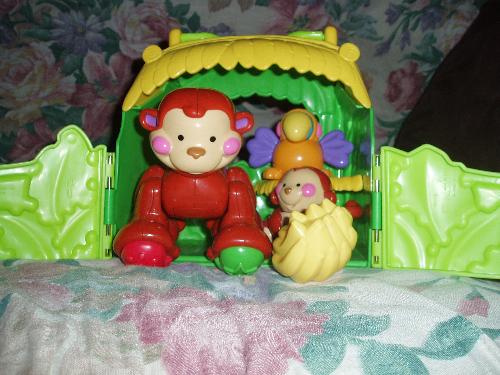 Amazing animals - Brooklyn's daddy bought her the monkey tote for Easter. The big monkey makes monkey sounds when his head is turned right and left, the little monkey and parrot are rattles. This set is so cute!
