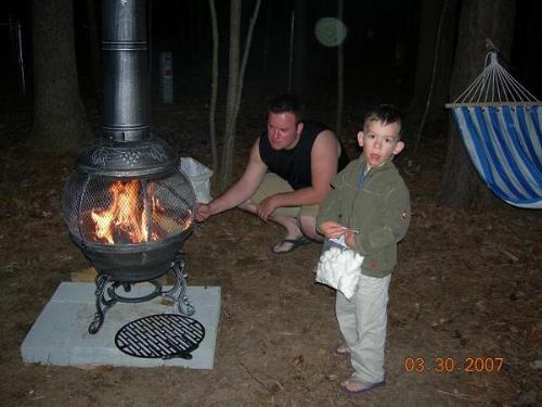 Fire pit - Jayden and daddy making smores outside.