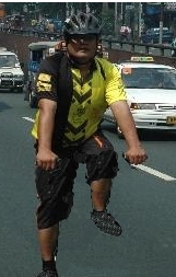 biking - This is a photoshopped picture of me biking in one of the streets in Manila, Philippines. I erased the bike so I would appear riding on an invisible bike