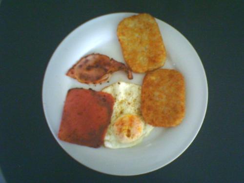 Breakfast - sunny side up egg, ham and hash brown breakfast