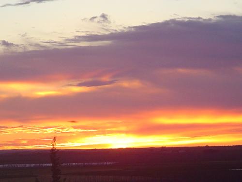 Taken at Camp Hansen - The sun setting at Camp Hansen in Northwestern Kansas.