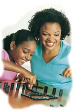 Mother Child - Mother and her daughter playing together. They are playing a board game and having fun. They're smiling and laughing, enjoying each other's company.