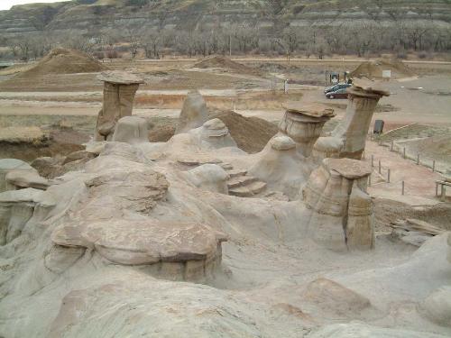 Hoodoos! Have you ever seen them? - On a trip in Alberta, Canada we took this picture of Hoodoos. I had never see them before. (Accoding to Wikipedia, the free encyclopedia; Hoodoos are talk thin spires of rock that protrude from the bottom of arid basins and badlands. They are composed of soft sedimentary rock and are topped by a piece of harder, less easily-eroded stone that protects the column from the elements.) You can imagine that when I first saw these I was certain that these were a man made creation but I was proven wrong! I understand they are found in many places in North America. Have you ever seen a Hoodoo?