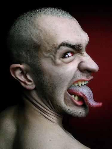 Demonic Tongue - Here's a strange photograph that I just came across. It appears to be either a demon or a vampire, I haven't decided which. LoL!