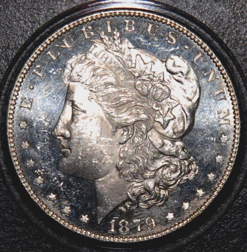 Morgan Dollar - I bought this dollar about 20 years ago at an outdoor flea market. The sun made the coin look terrible so I got it for a little above melt. Much to my surprise and with the proper lighting, it was a very good buy for an 'S' mintmark.