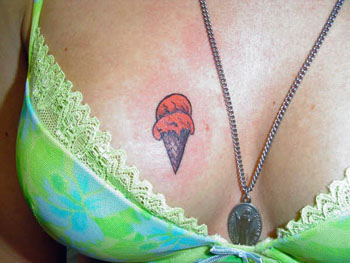 Ice Cream Tatto - A girl with an ice cream cone tattooed on her chest.