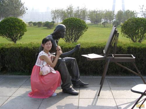 the one with a statue - I was taking a travel in Dalian City, Liaoning Province, China, it's a really beautiful city which is beside the sea. I was in a square with the Chinese name 'Xing Hai Guang Chang', which means Starry Sea Square, it is the largest integrated square in Asia. The statue is an artist, 'he' is very handsome, when I was 'him', It's like I could feel 'his' breath, lol... the dress bought during my travel in Dalian, though it's late fall, it was still very hot in that city, I had to change my sweater to a dress, and it only cost me RMB39, lol... the most embarrasing is that I didn't take sandals with me, what's worse is that I have no money to buy a new pair, you know, sandals were very expensive in Dalian City, so I had to take photo with my sports shoe....sigh...