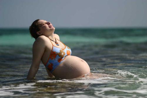 happy to take a bath of sun - pregnancy a special time for all women...