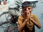 A boy begging in public - begging