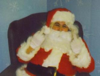 me as Santa  - this is something I did  for pets with santa  it was fun  until they thought  that a 200lb lab  could sit on me