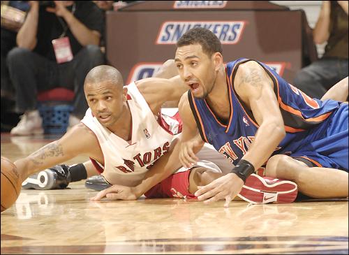 Juan Dixon going for a loose ball against Jared Je - Juan Dixon going for a loose ball against Jared Jeffies while the Raptors are hosting the Knicks