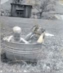 Bathing In a Galvanized Tub - image showing children playing/bathing in a galvanized tub just like in the old days when some people had no indoor plumbing.