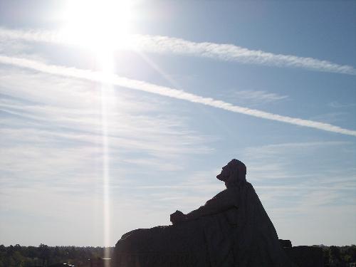 Sky Cross - This photo was taken by a young man at mu church named Avery. He was taking photos of the stutue of Jesus when a small plane flew by. Seeing that the trail it made resembled a cross he snapped the shot.  This photo was later entered into the Regional Youth Quest competition, where it placed.