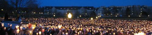 Virginia Tech massacre - Virginia Tech students mourn their fallen friends at a candlelight vigil.