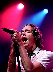 Incubus - Brandon singing on stage.