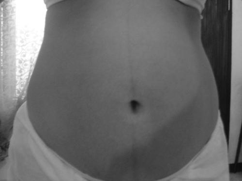 my 7mos. and 1wk. old tummy - This photo was taken before I left our house for work. I feel so happy whenever I see my big tummy, I feel sexier when I look at the mirror...