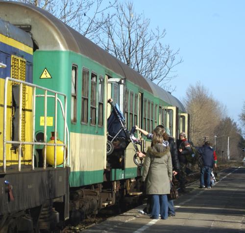 people getting on train - train before its departure, people getting on train