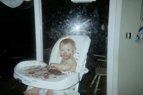My nephew - This is his first birthday. It is a ritual in my family that babies get a birthday cake for theirselfs and here he is enjoying his first birthday.