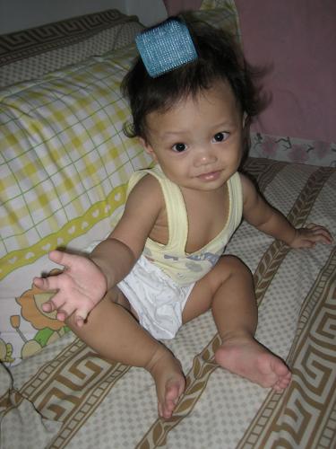 Is my hair OK? - I like to she her busy, so I put a hair roll on her hair. She is really busy with it. Lucky that she has a thin hair, So both me and her never have any problem with it.