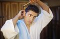 Combing - Man combing his hair