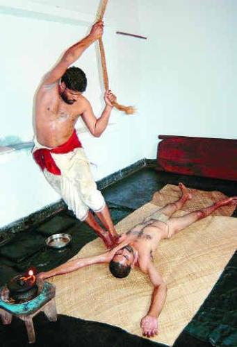 kalari message - this i the picture of kalari messag its very good for our body if any body want to loos weight they can do this time of message. the person who got very flexible body