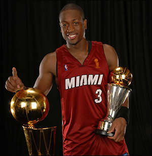 Dwyane Wade - Dwyane Wade with two trophies, championship and mvp