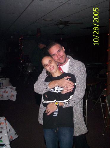 Me and husband at hollween party - This is a photo of me and my husband at a hollween party in 2005. I know a little out of date but it's the closest a picture of me and him I have so far on my computer. LOL!!